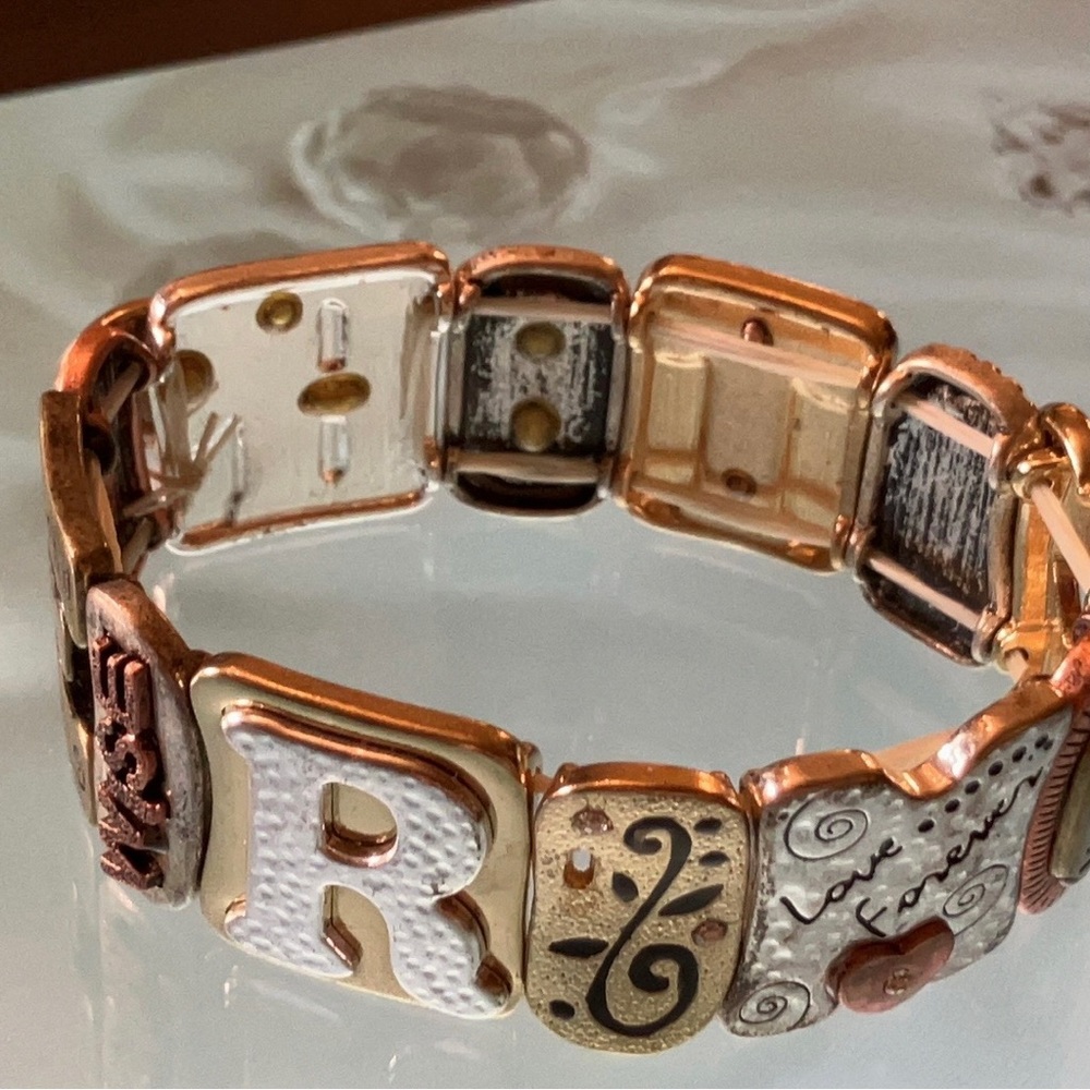 Marvelous 1990s stretch statement bracelet filled with love.